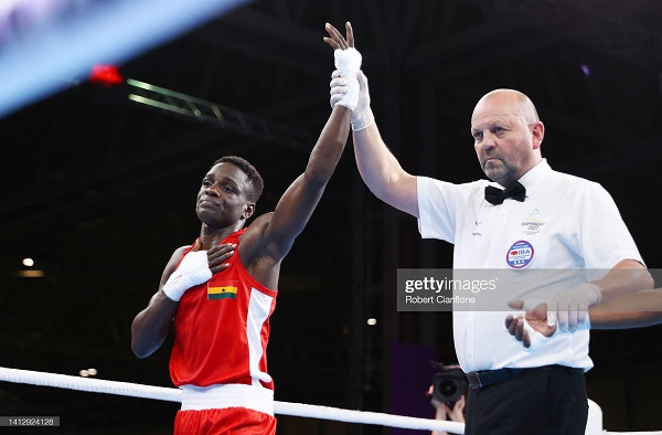 Referee Geoff Cannel declares Abraham Mensah winner of his fight against Rukmal Prasanna 